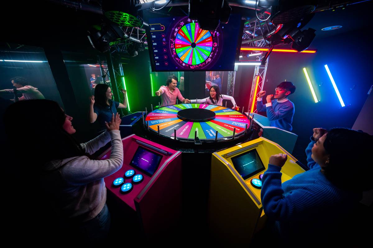 Beat your friends at BuzzAttack, the new live game show experience as seen on TV – with music challenges, buzzers, and a giant spinning wheel